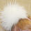 smallПомпон белый финский енот 21 см по перьям
